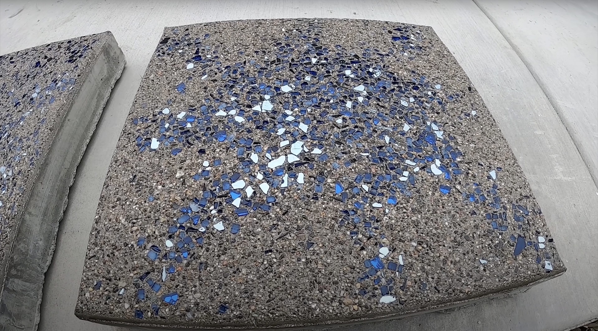 Premium concrete materials with decorative aggregate for enhanced durability High-quality concrete mix with decorative blue and white aggregate finish