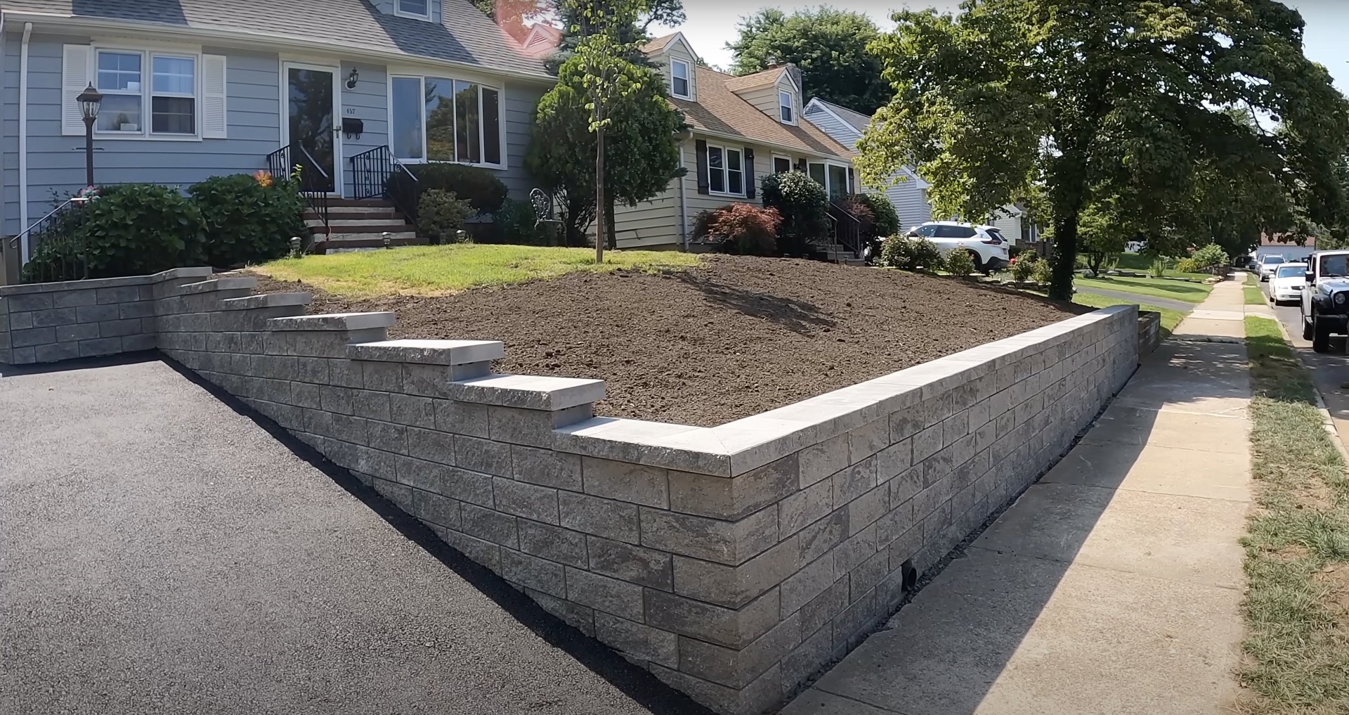 Quality concrete retaining wall construction with professional landscaping Professional concrete retaining wall installation in Bartlett TN residential area